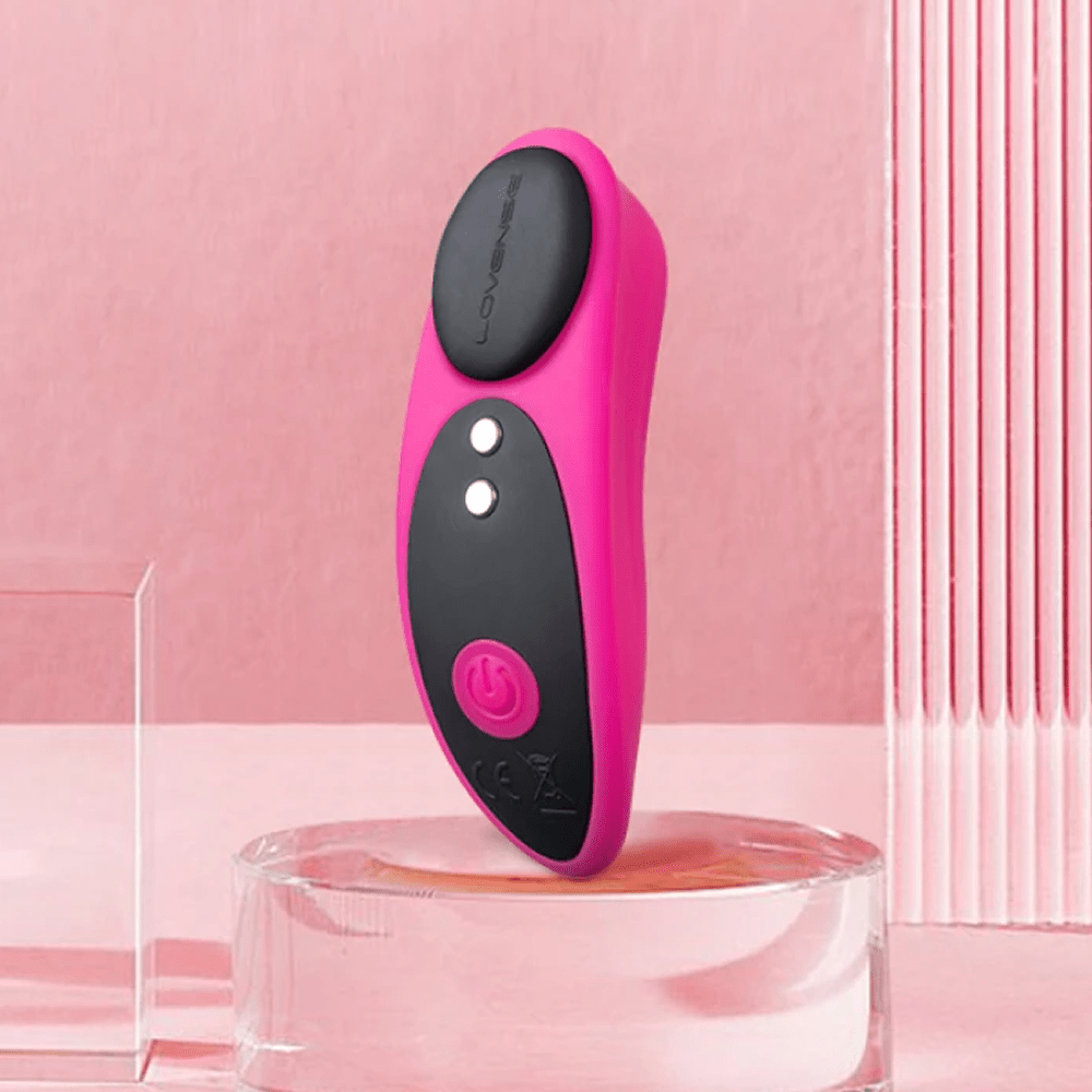 Lovense Ferri app-connected magnetic vibrating panty vibrator on a pink background