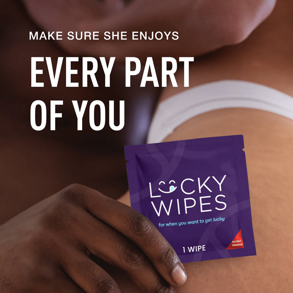 Person's hand holding Sweetums Lucky Wipes packet with white text "Make sure she enjoys every part of you"