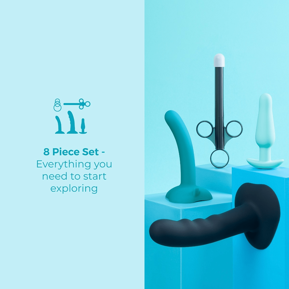 B-Vibe Strap-It-On Anal Training Kit components on a blue studio background with text that reads "8-Piece Set: Everything you need to start exploring"