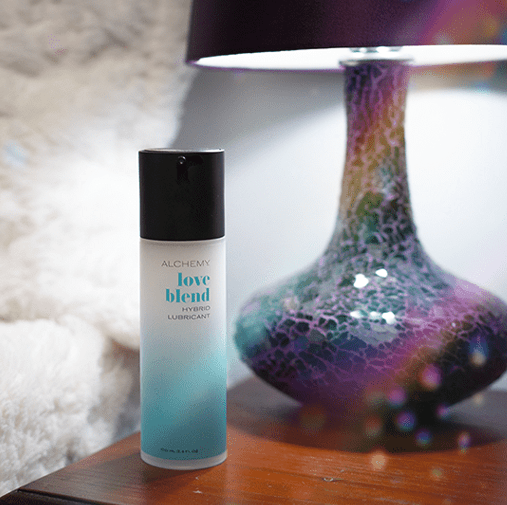 Alchemy Love Blend: Hybrid Personal Lubricant bottle on nightstand