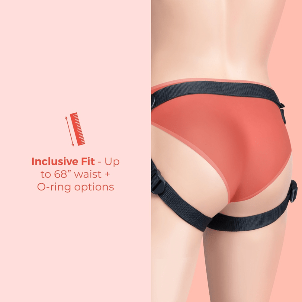 B-Vibe Beginners Strap-On Harness Set with 5-Inch Silicone Dildo Peg on a pink background with text that reads "Inclusive fit: up to 68-inch waist and O-ring options"