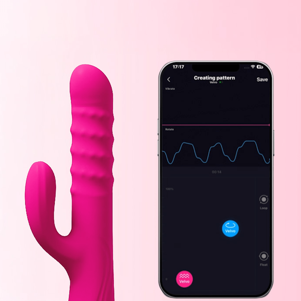 Lovense Velvo app-controlled thrusting rabbit vibrator next to a smartphone showing Lovense Remote App on a pink background
