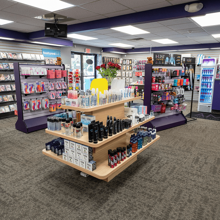 Amazing Intimate Essentials Meriden Connecticut store interior with product displays on shelves and walls.