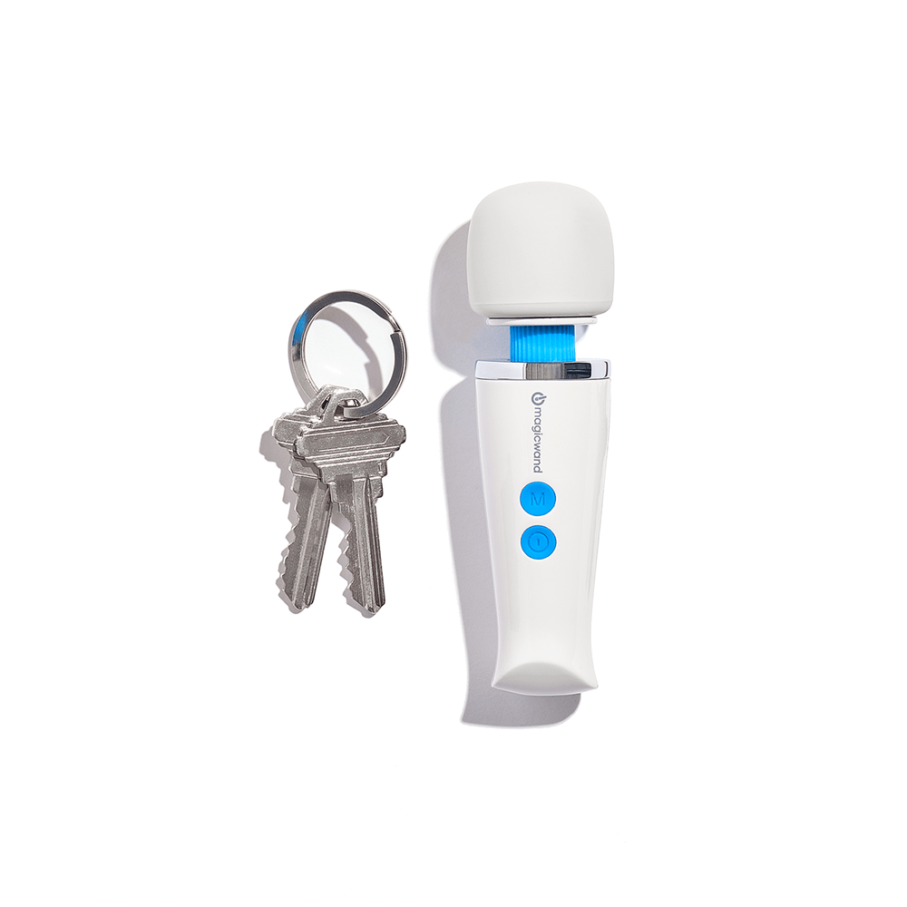 Hitachi Magic Wand Micro HV-60 wand massager next to a set of house keys showing the size of the product on a white background with overhead lighting