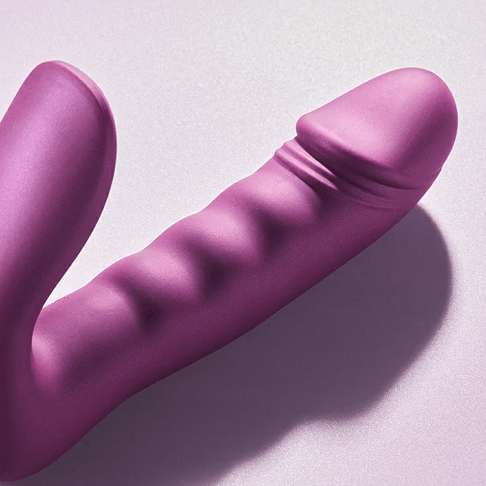 Honey Play Box Rora 2 App-Controlled G-Spot and Clitoral Vibrator: close-up photo of the shaft of the product on a gray background in sunlight