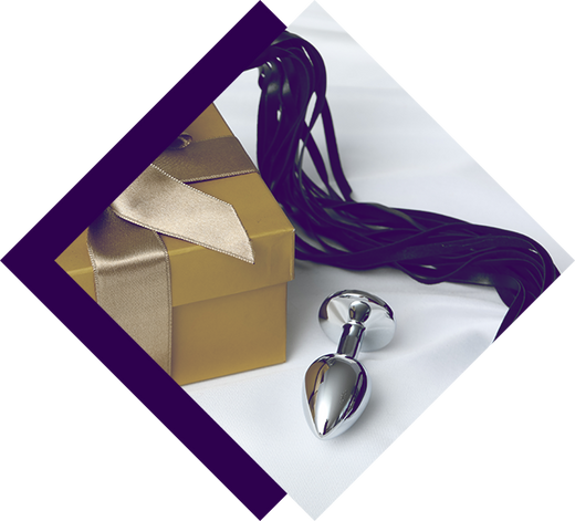 An anal plug, flogger, and gift box