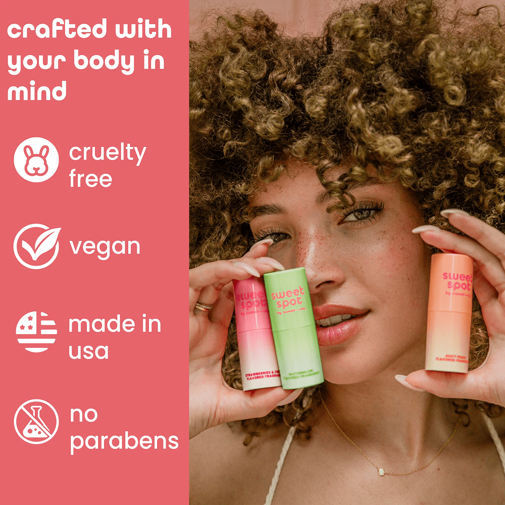 Woman holding Sweetums Sweet Spot tubes with brand information on a pink background: "Crafted with your body in mind: cruelty free, vegan, made in USA, no parabens