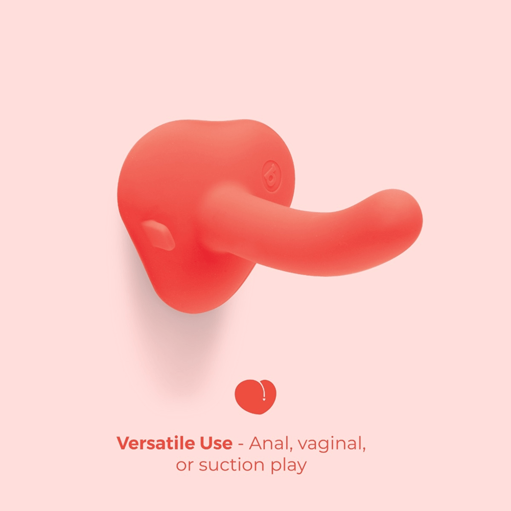 B-Vibe Beginners Strap-On 5-Inch Silicone Dildo Peg on pink background with text that reads "Versatile use: anal, vaginal, or suction play"