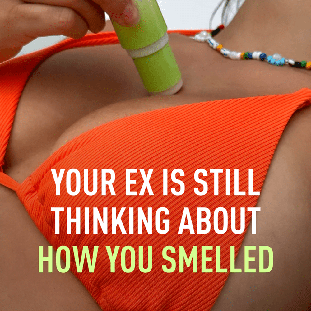 Person in orange bikini applying Sweetums Sweet Spot flavored fragrance tube with white and yellow text "Your ex is still thinking about how you smelled"
