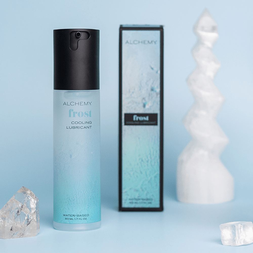 Alchemy Frost cooling lubricant bottle and packaging on a light blue background