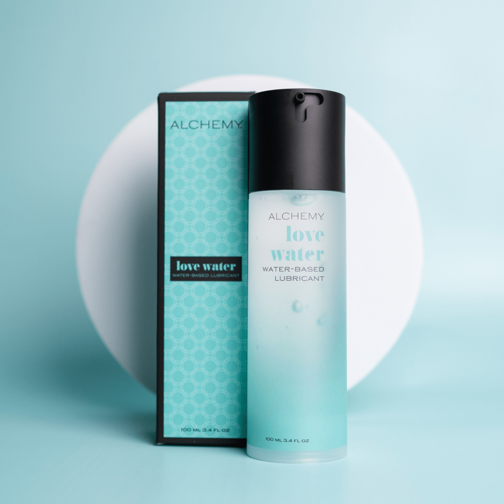 Alchemy Love Water product packaging on a light blue background