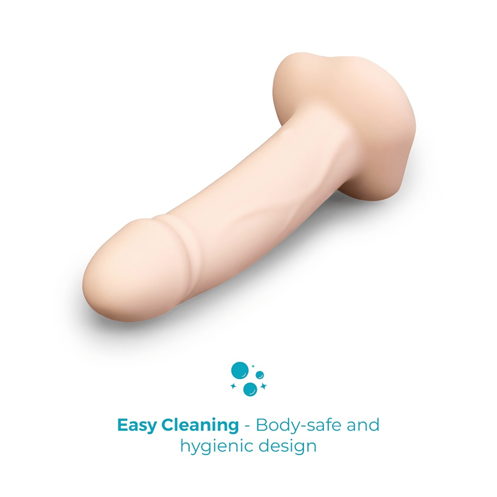 B-Vibe Every Body Vibrating Strap-On Dildo on a white background with text that reads "Easy cleaning: body-safe and hygienic design"