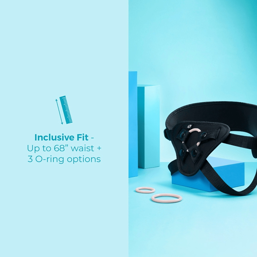 B-Vibe Every Body Vibrating Strap-On Dildo Kit on a blue studio background with text that reads "Inclusive fit: up to 68" waist and 3 O-ring options"