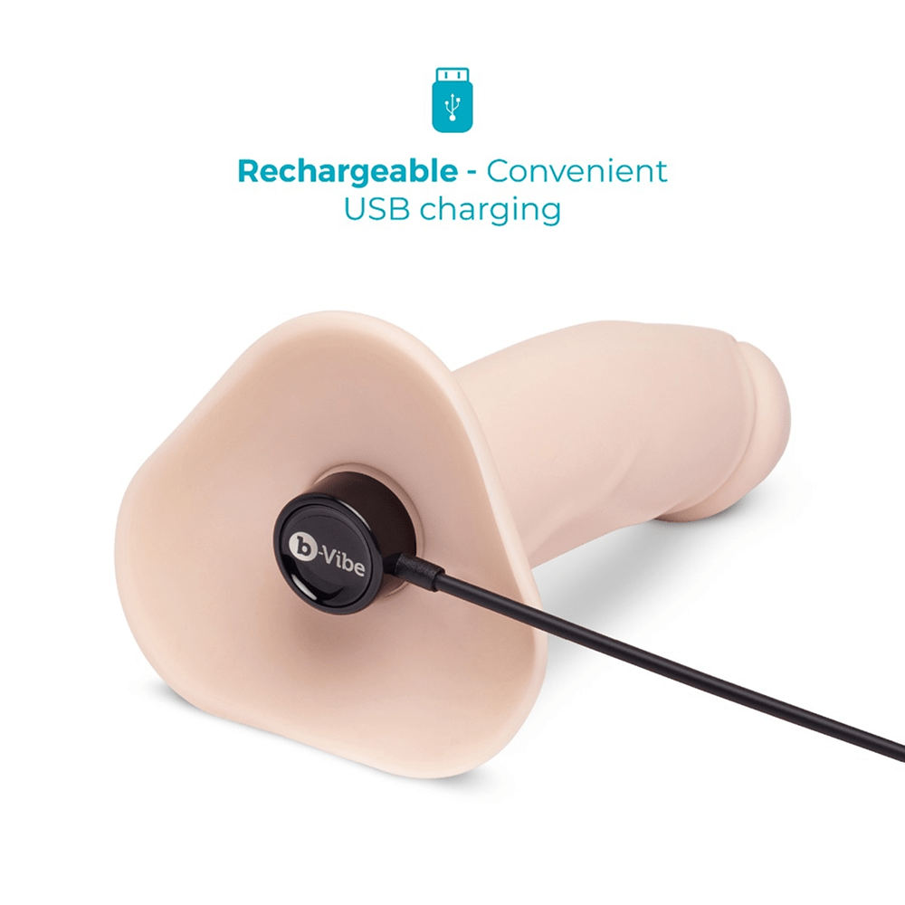B-Vibe Every Body Vibrating Strap-On DIldo with magnetic USB charging cable on a white background
