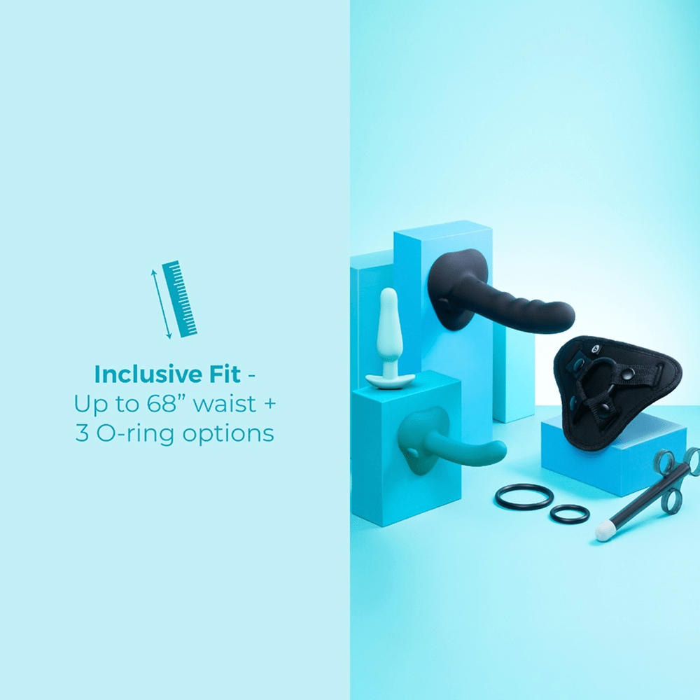 B-Vibe Strap-It-On Anal Training Kit  components on blue studio background setup with text that reads "inclusive fit: up to 68-inch waist and 3 O-ring options"