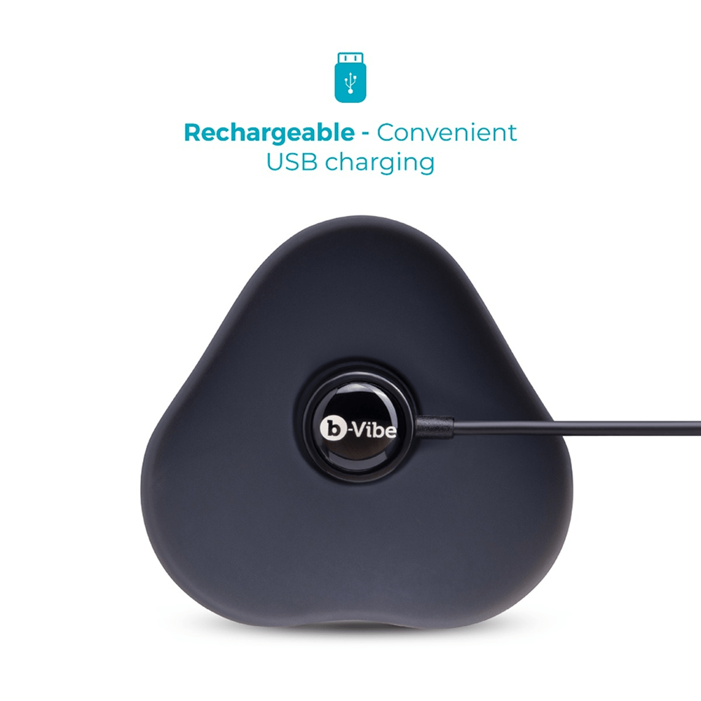 B-Vibe Strap-It-On Anal Training Kit: close-up of the bottom of one of the included toys with a B-Vibe magnetic USB charging cable attached to the product