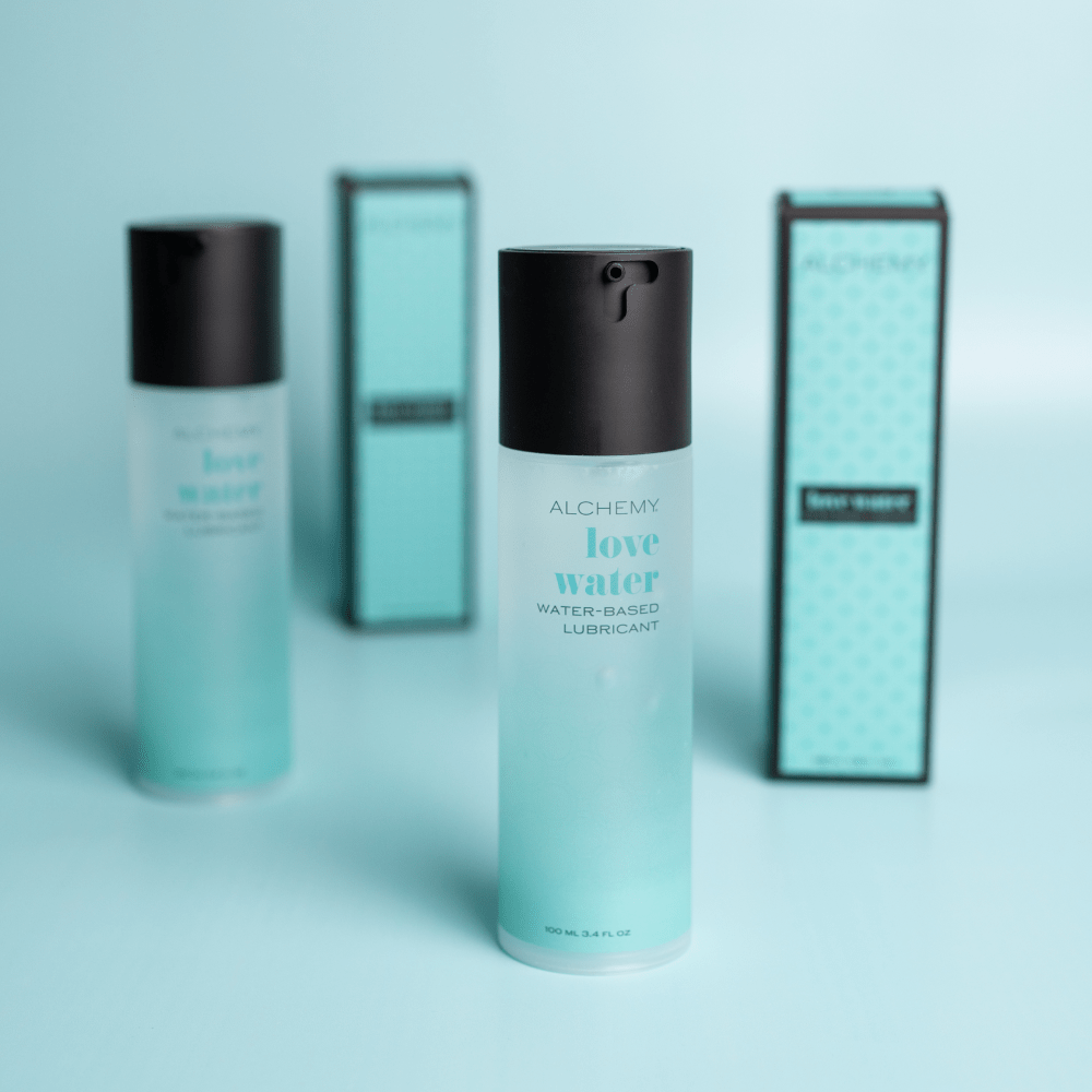 Alchemy Love Water: Water-Based Personal Lubricant with box on light blue background