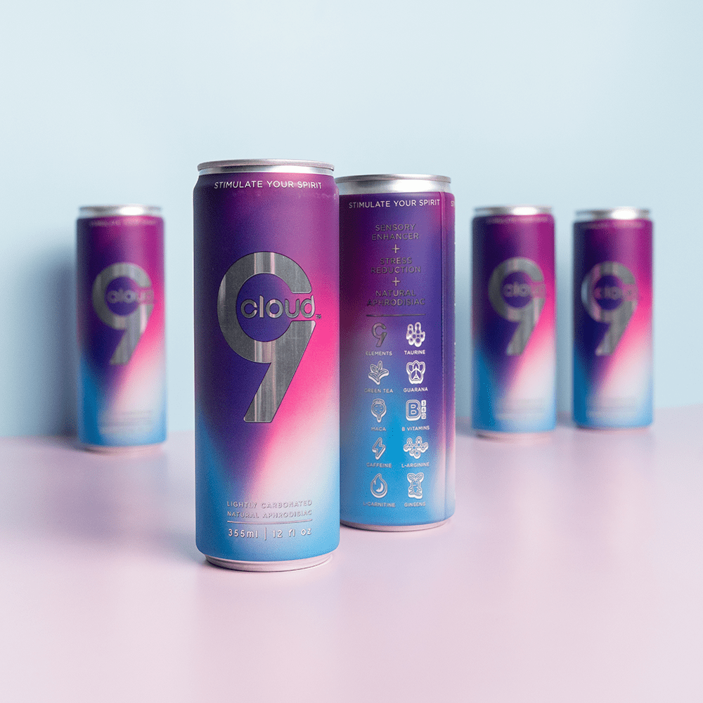 Five Cloud 9 Aphrodisiac Drink cans with soft studio lighting and a light purple background