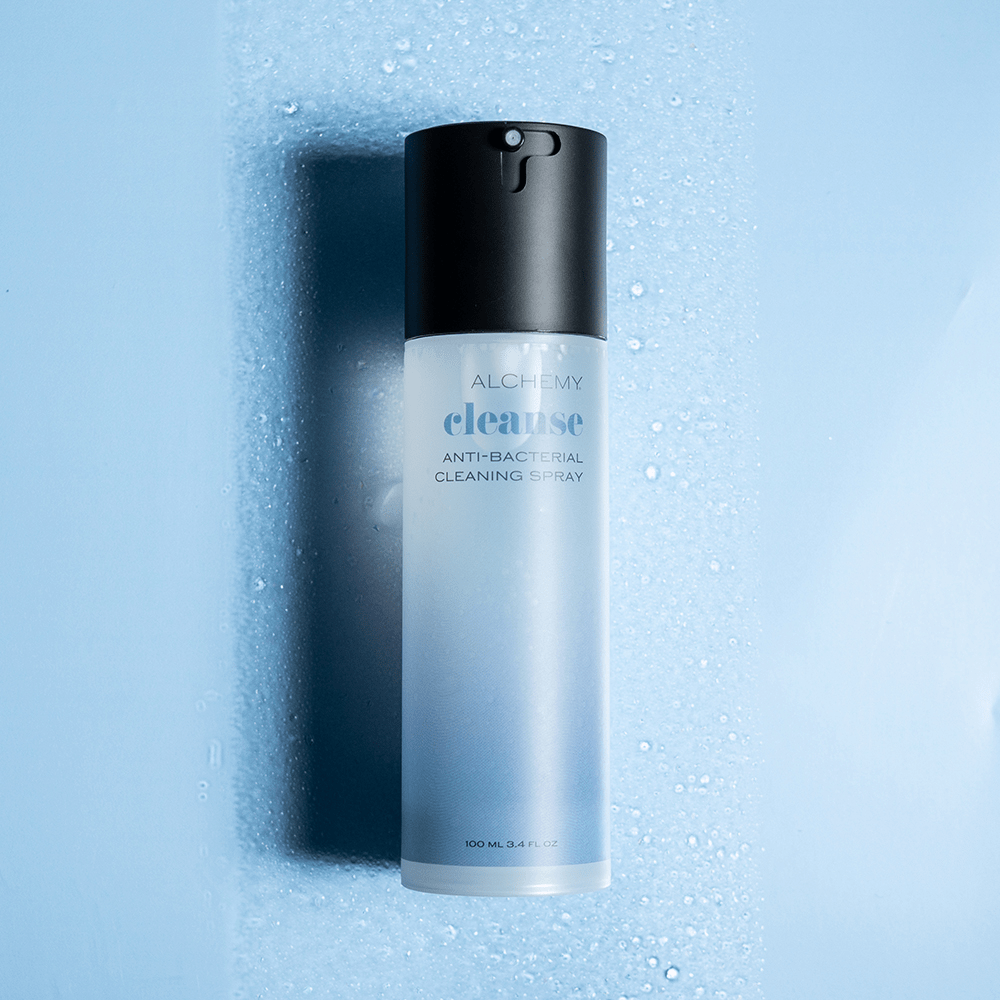 Alchemy Cleanse Spray Toy Cleaner bottle with liquid droplets