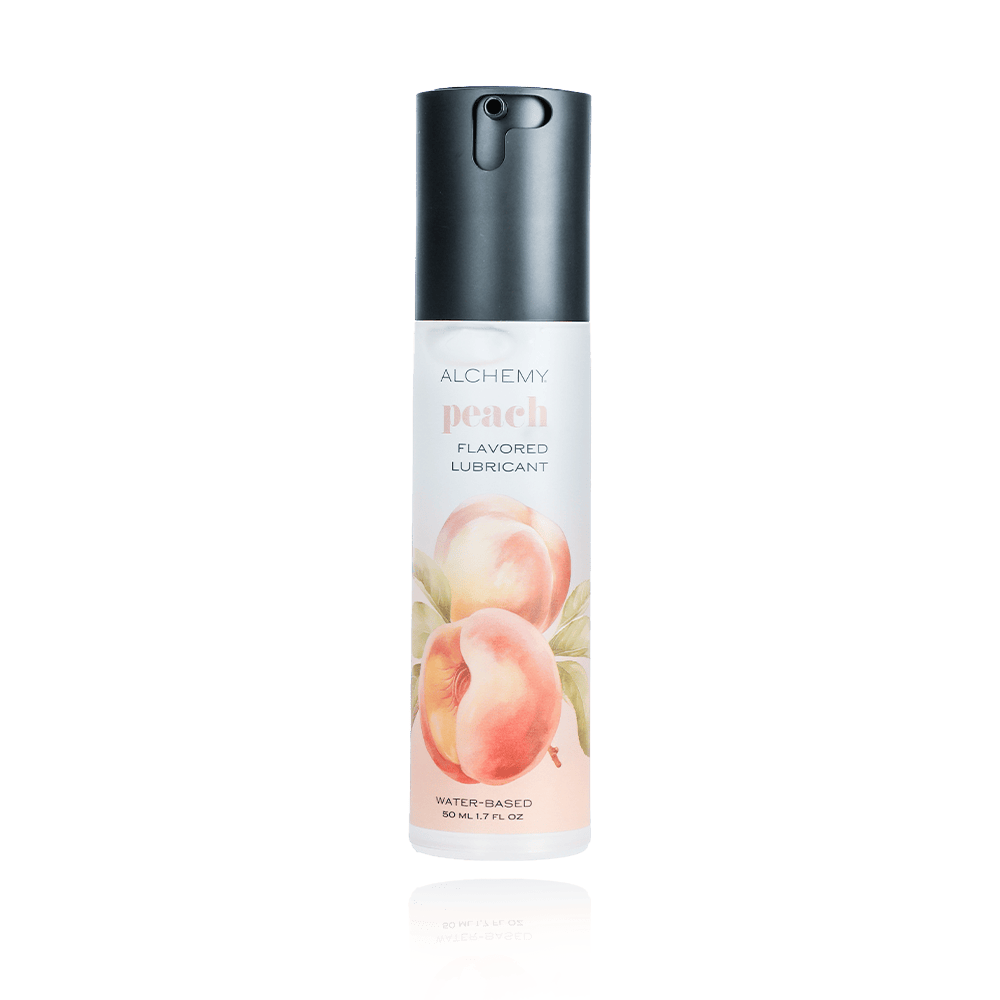 Alchemy Indulge – Peach Flavored Personal Lubricant on a white background with reflection