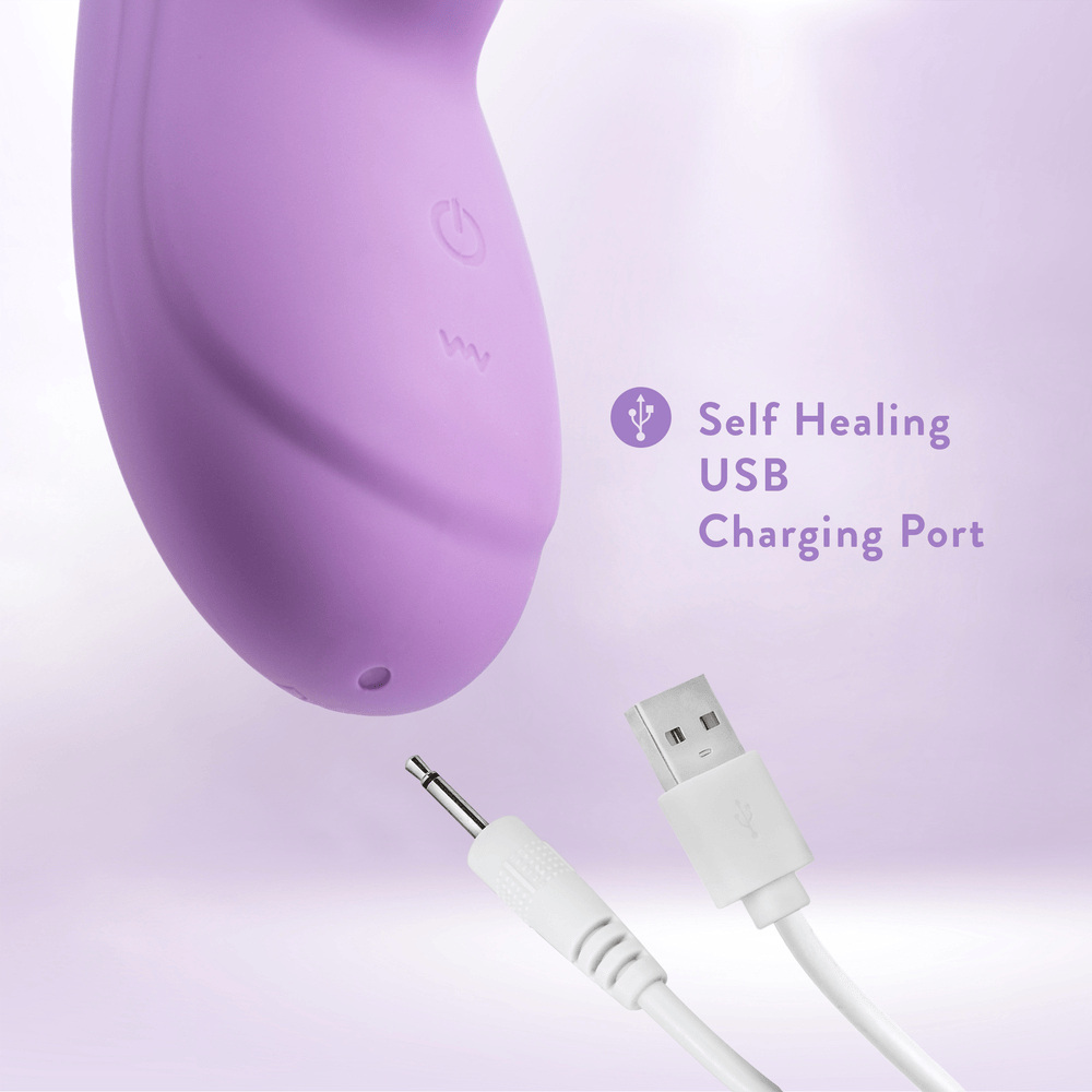 Blush Evelyn purple rabbit vibrator with power cord plugged in