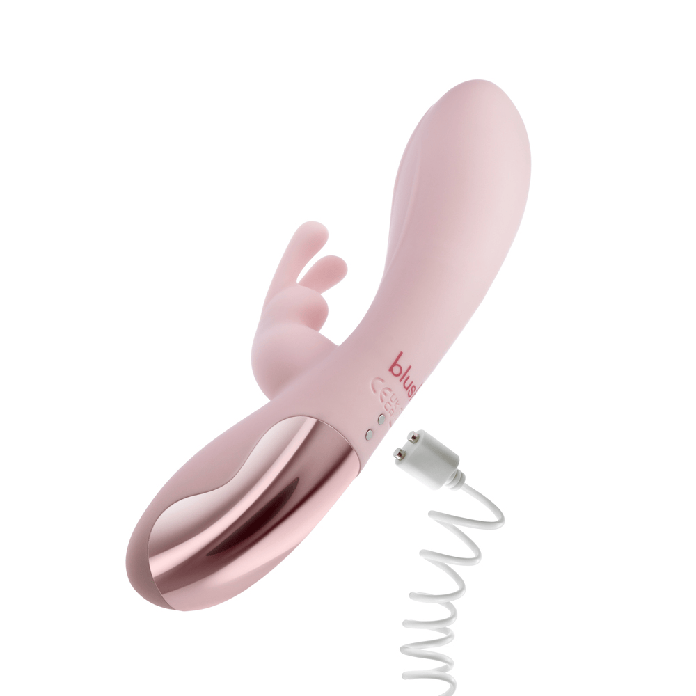 Blush Morgan pink rabbit vibrator with power cord plugged in
