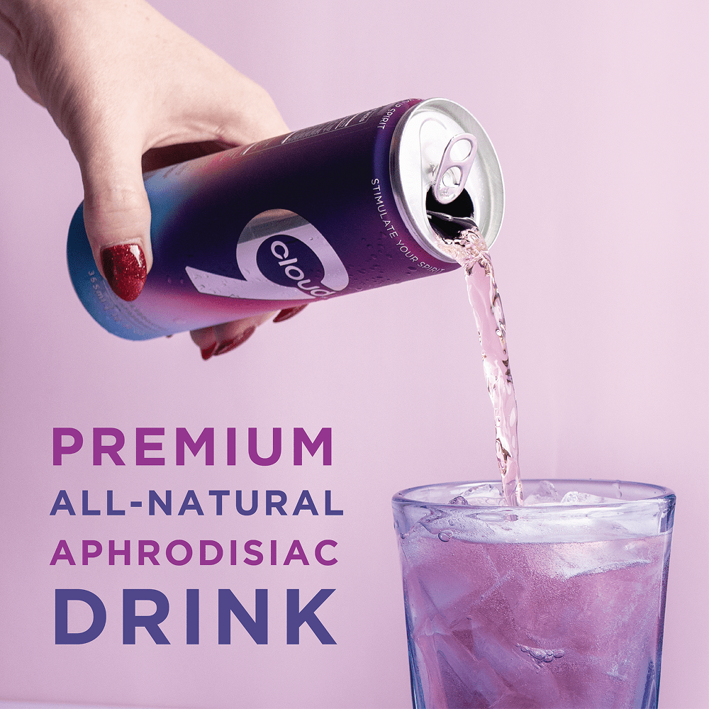 Person's hand pouring a can of Cloud 9 Aphrodisiac Drink into a glass with purple text on a pink background that says "Premium All-Natural Aphrodisiac Drink"