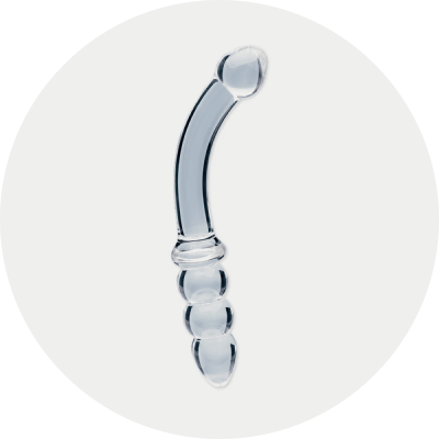 Clarity glass dildo in a light gray circle background