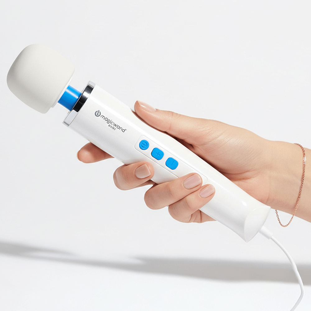 Photo of Hitachi Magic Wand Mini in a woman's hands on a white background with studio lighting