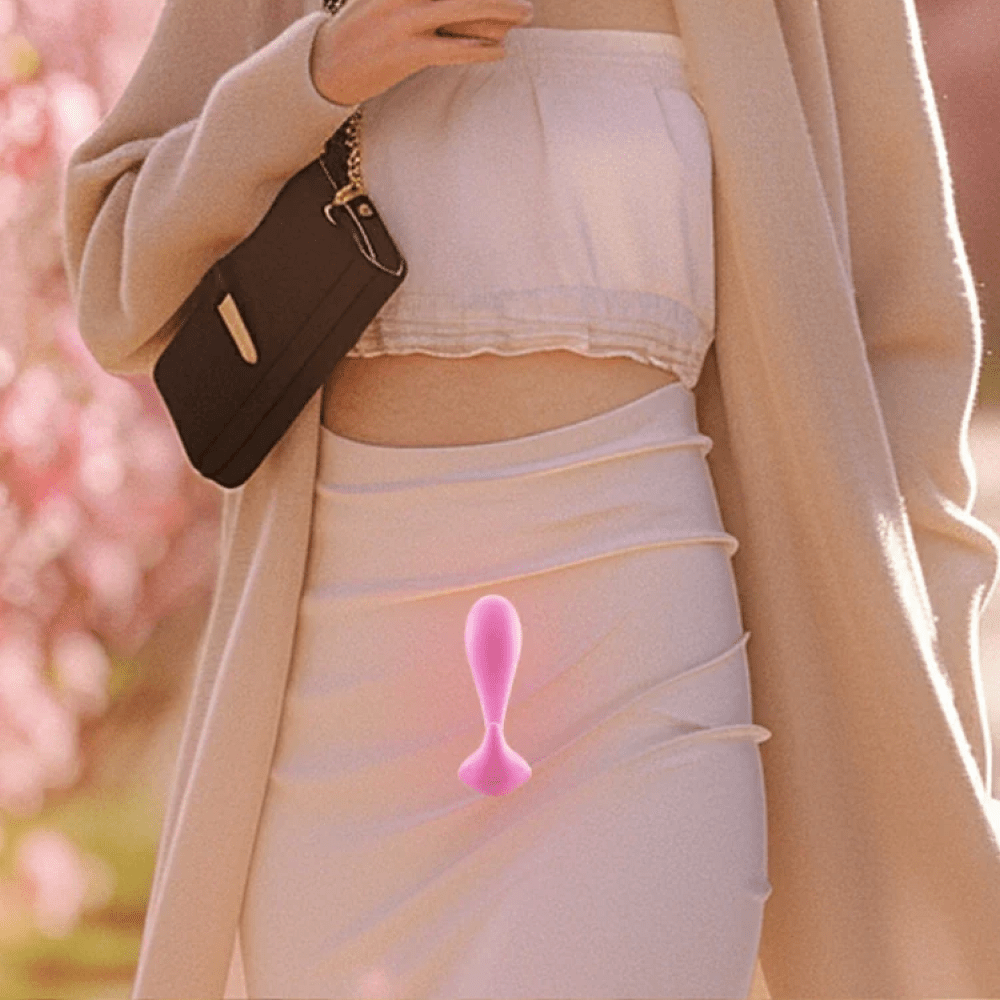 Honey Play Box Oly 2 App-Controlled G-Spot Vibrator superimposed on a photo of the torso of a woman walking outdoors in public