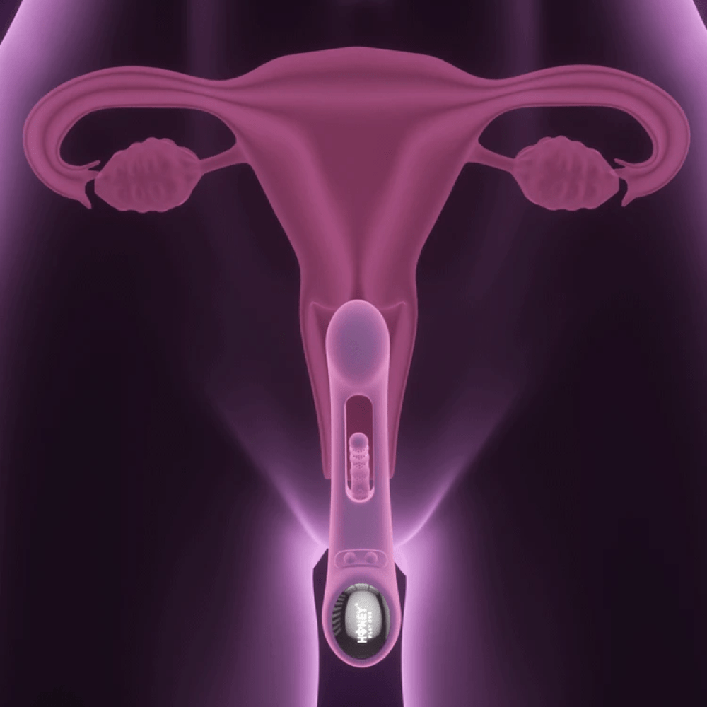 Honey Play Box Tempo App-Controlled Tapping Vibrator - 3D rendering of the product showing anatomical placement and scale with a person's uterus on a dark purple background