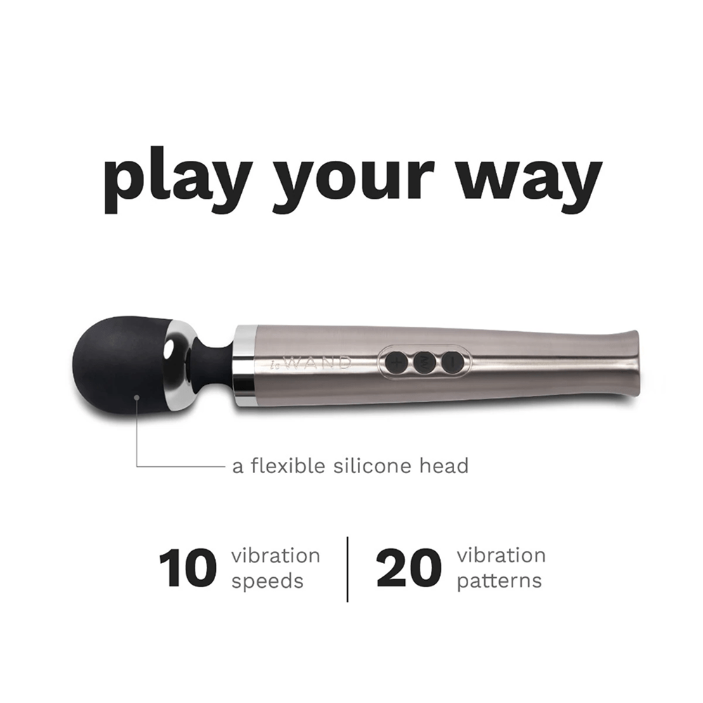 Le Wand Diecast Luxury Wand Massager on white background with dark gray text: "Play Your Way: a flexible silicone head with 10 vibration speeds and 20 vibration patterns"