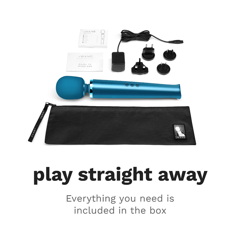 Photo of blue Le Wand Rechargeable Luxury Wand Massager on a white background with dark gray text and included accessories: "Play Straight Away: everything you need is included in the box"