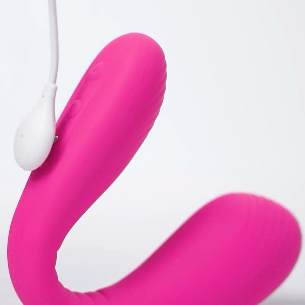 Close-up photo of Lovense Dolce App-Connected Couples Vibrator and magnetic USB cord connector