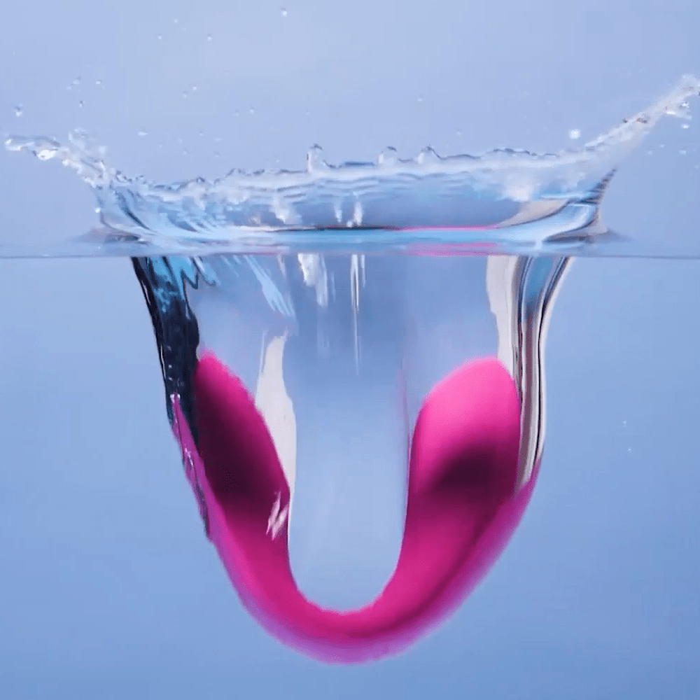 Photo of Lovense Dolce App-Connected Couples Vibrator splashing into water showing waterproof features