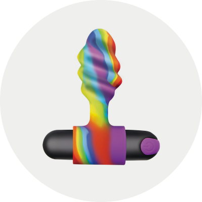 Rainbow-colored silicone vibrating butt plug in a gray circle background