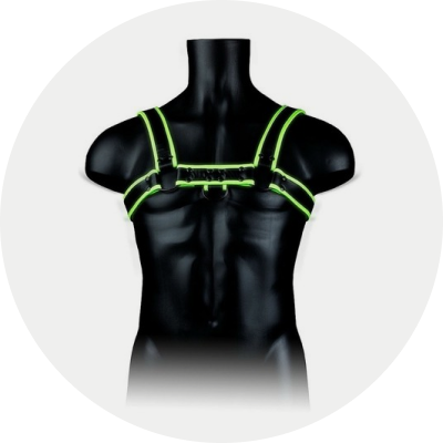 Glow-in-the-dark body harness on a dark mannequin torso in a light gray circle background